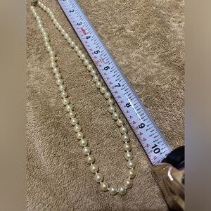 Costume pearl necklace.